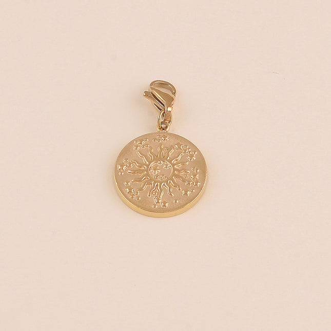 Charm - médaillon rond, soleil et étoiles