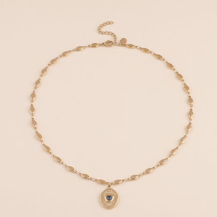 Collier - maillons coquilles et pendentif ovale texturé avec coeur en cristal