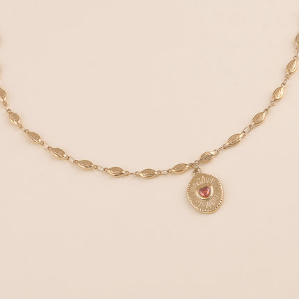 Collier - maillons coquilles et pendentif ovale texturé avec coeur en cristal