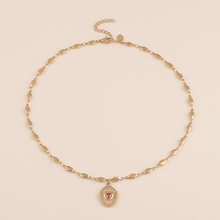 Collier - maillons coquilles et pendentif ovale texturé avec coeur en cristal