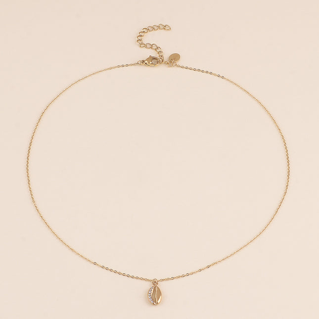 Collier - motif cauri et cristaux