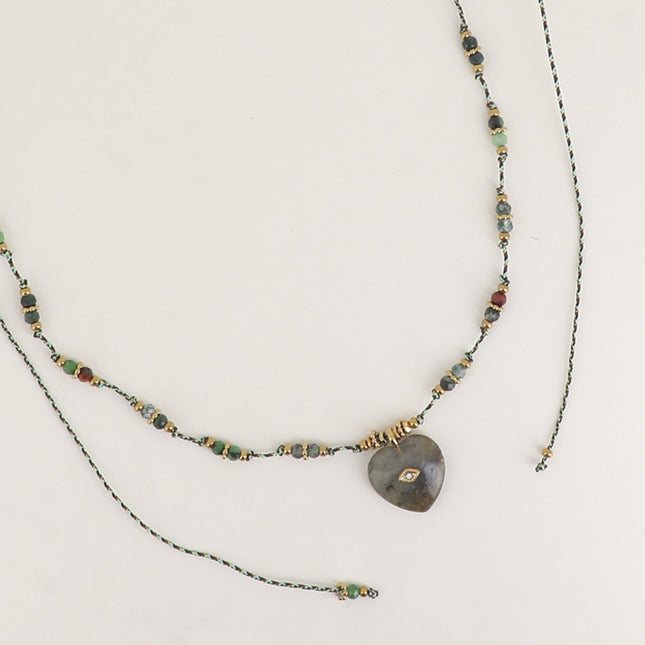 Sautoir sur fil - perles en acier, pierres naturelles et coeur brossé avec oeil et cristal