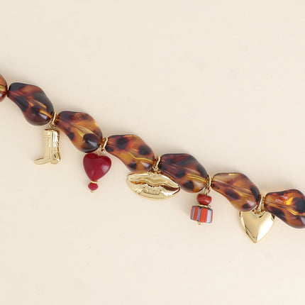 Bracelet sur fil - perles en résine et de pampilles en acier inoxydable (botte, perle coeur, bouche, céramique émaillée, coeur)