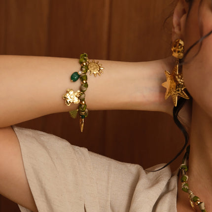 Bracelet Orin - coeur, fleur, soleil, pompon, perle et perle d'eau douce