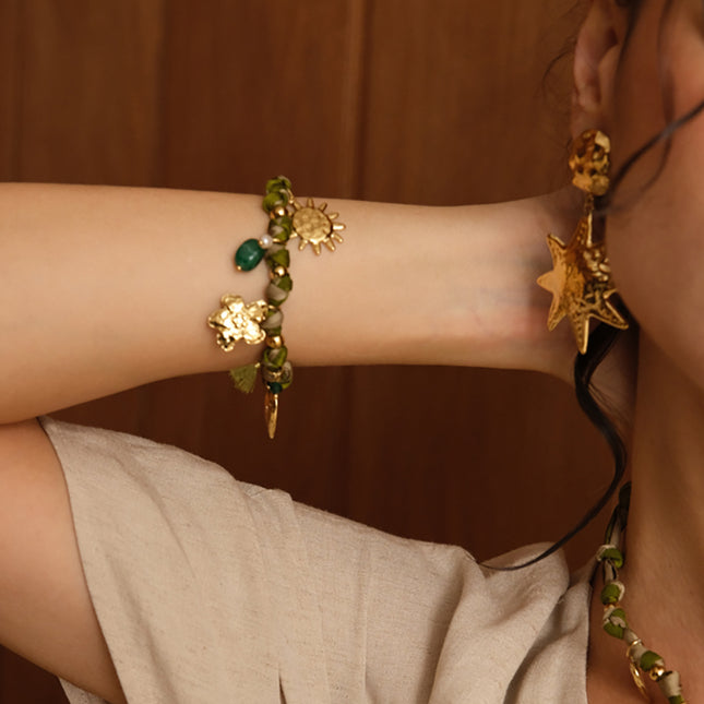 Bracelet Orin - coeur, fleur, soleil, pompon, perle et perle d'eau douce