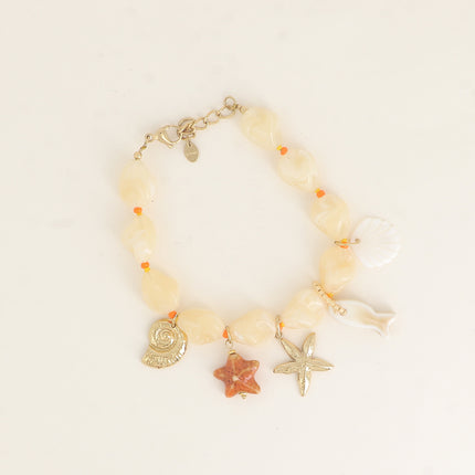 Bracelet sur câble - perles en résine, coquillages, étoiles de mer, céramique