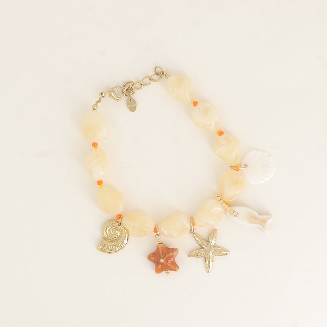 Bracelet sur câble - perles en résine, coquillages, étoiles de mer, céramique