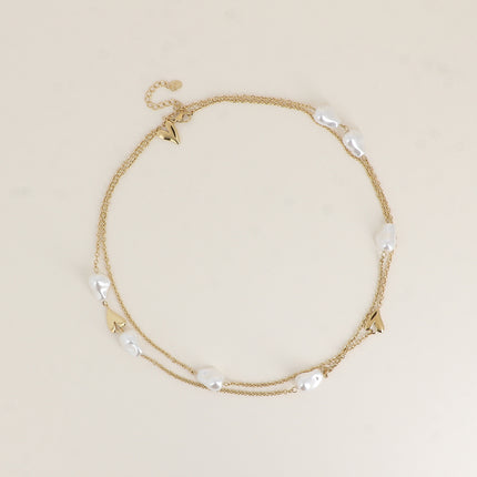 Sautoir - pendentifs coeurs et perles de résine