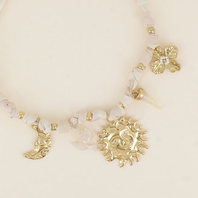 Lunéa Necklace - moon, sun, resin horn, flower