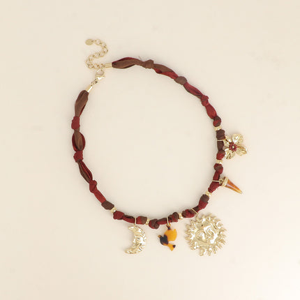Lunéa Necklace - moon, sun, resin horn, flower