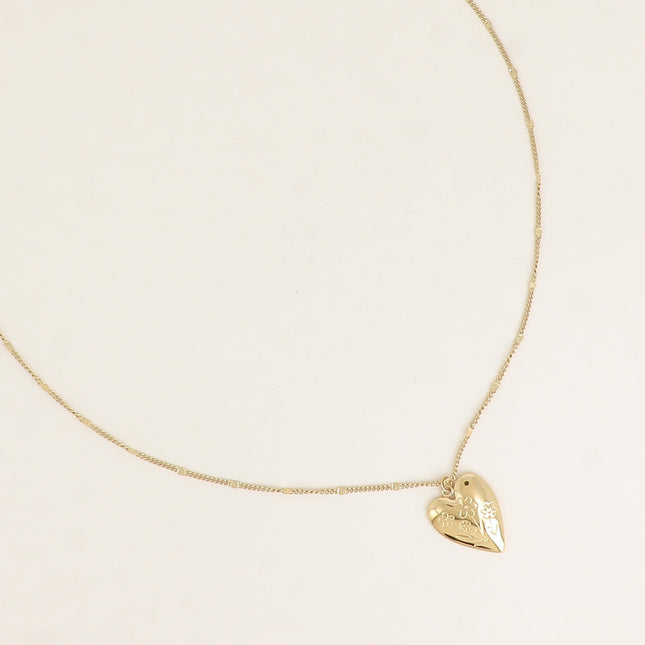 Collier - pendentif coeur avec fleurs gravées