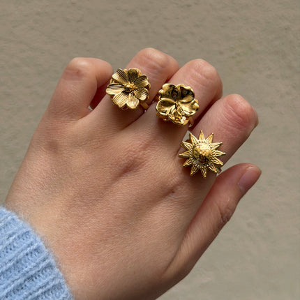 Bague rotative avec soleil texturé tournant