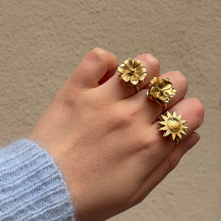 Bague rotative avec fleur texturée tournante
