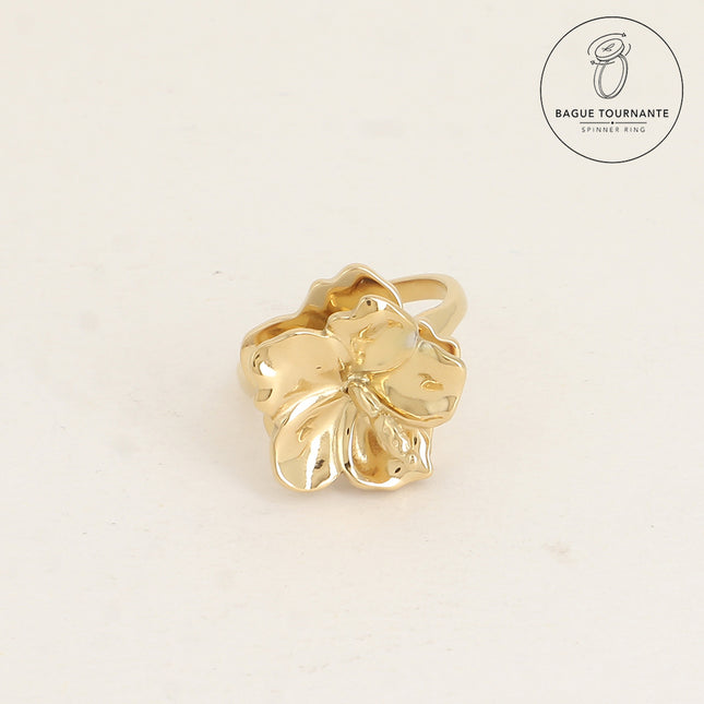 Rotating ring with revolving hibiscus flower