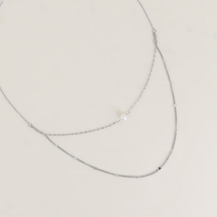 Collier - 2 rangs avec perle de résine blanche