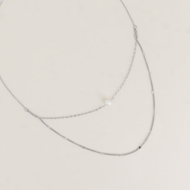 Collier - 2 rangs avec perle de résine blanche