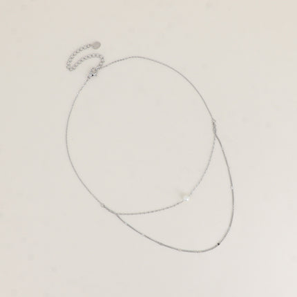 Collier - 2 rangs avec perle de résine blanche
