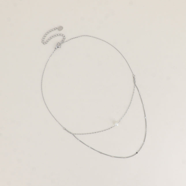 Collier - 2 rangs avec perle de résine blanche