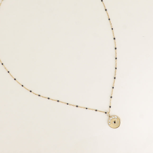 Collier - chaîne émaillée et pendentif rond avec oeil gravé et cristaux