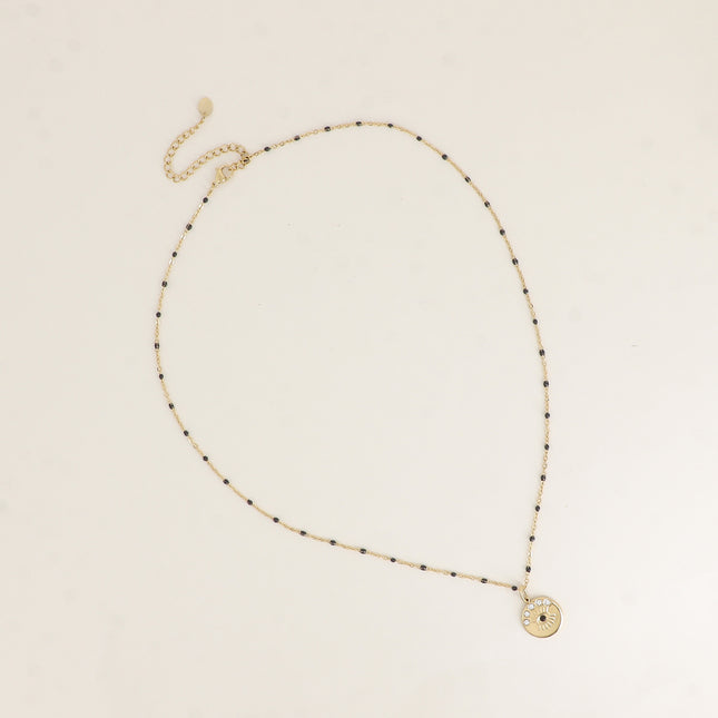 Collier - chaîne émaillée et pendentif rond avec oeil gravé et cristaux