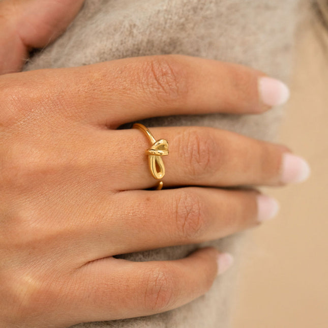 Ring - thin and open, knot on the side