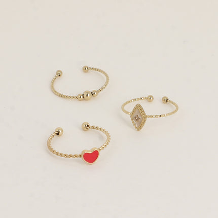 Set de 3 bagues Manguy - 3 boules, coeur émaillé et losange émaillé serti d'un oxyde de zirconium