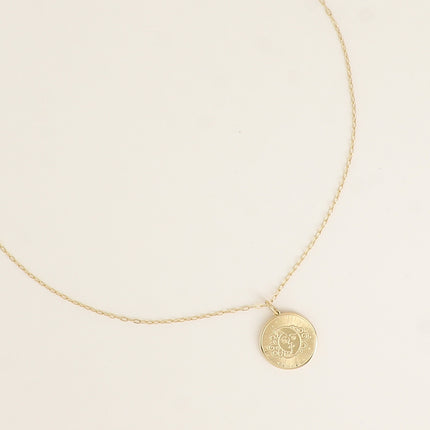 Collier - pendentif rond avec une éclipse gravée