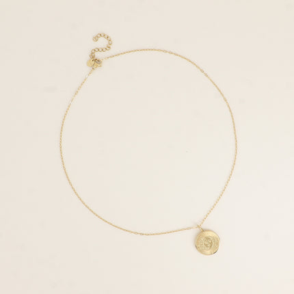 Collier - pendentif rond avec une éclipse gravée