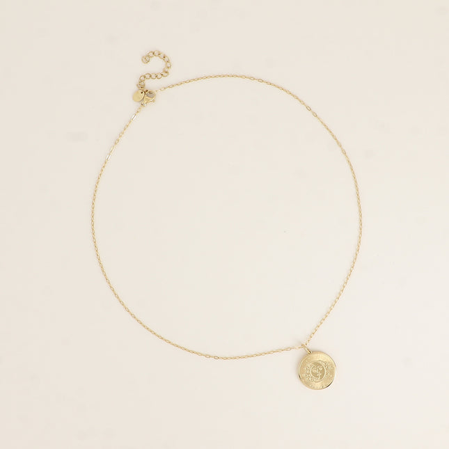Collier - pendentif rond avec une éclipse gravée