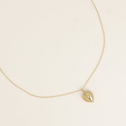 Collier - pendentif coeur aux contours grainés