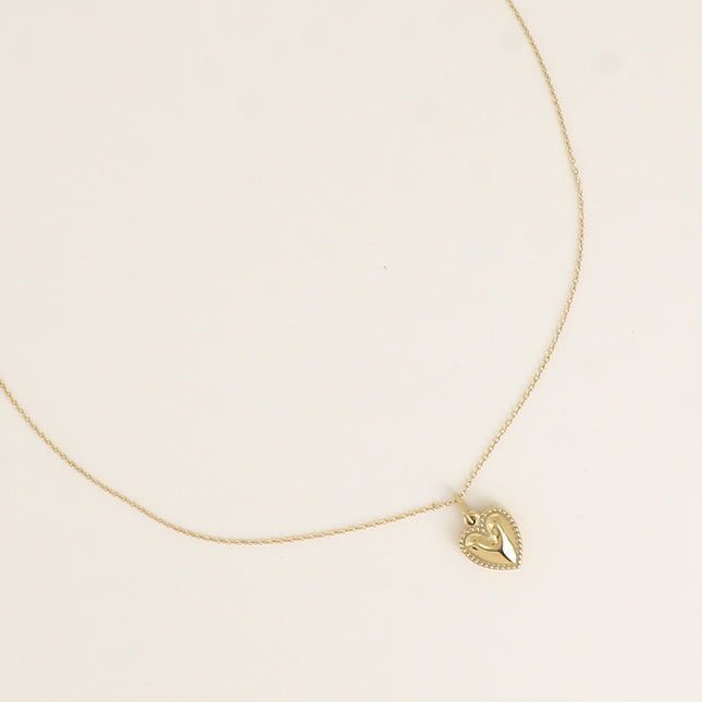 Collier - pendentif coeur aux contours grainés