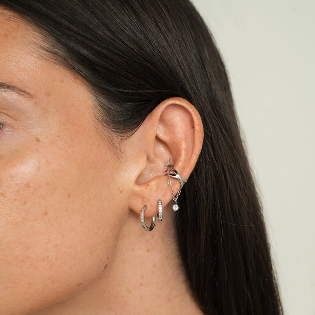 Earcuffs - two criss-cross rings and a crystal on a dangling chain