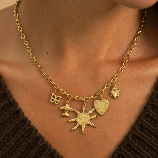 Collier - papillon, avion, soleil, coeur avec oxydes de zirconium et trèfle
