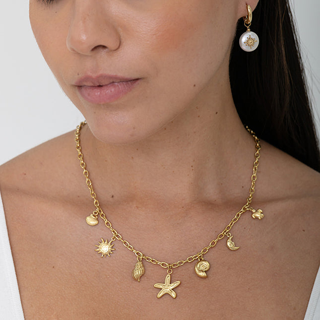 Collier - breloques (étoile de mer, soleil, lune, coquillages, tortue)