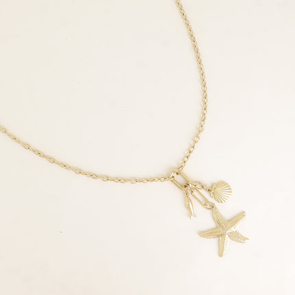 Collier - anneau ovale et 3 pendentifs (coquillage, poisson et étoile de mer)