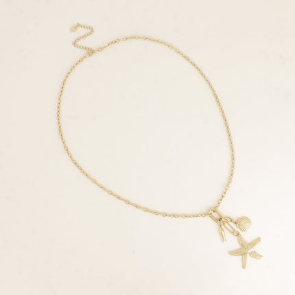 Collier - anneau ovale et 3 pendentifs (coquillage, poisson et étoile de mer)