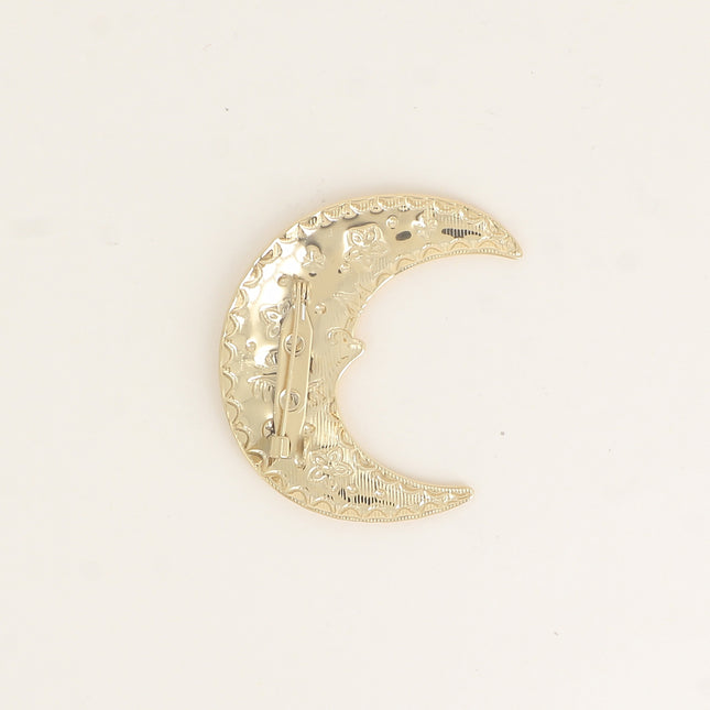 Broche - croissant de lune et de petits motifs (oeil, fleurs, points) gravés