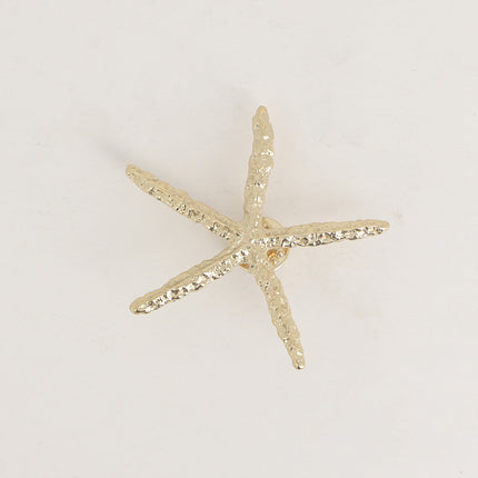 Pin's - étoile de mer aux branches fines texturées