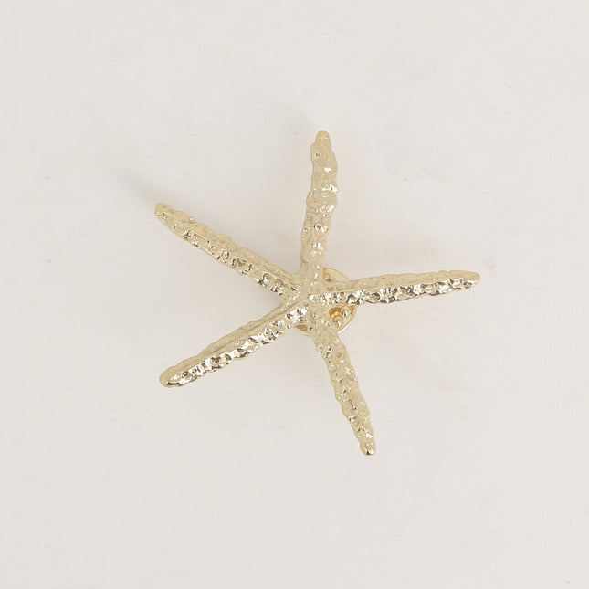 Pin's - étoile de mer aux branches fines texturées