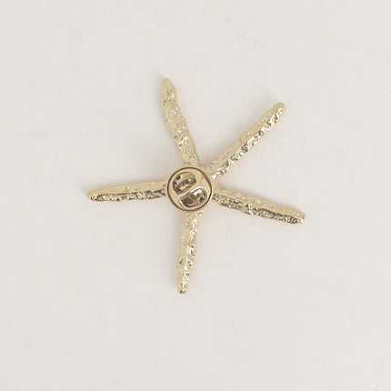 Pin's - étoile de mer aux branches fines texturées