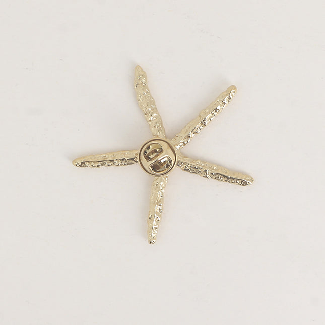 Pin's - étoile de mer aux branches fines texturées