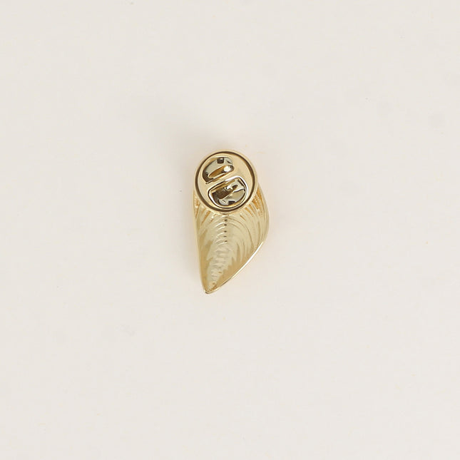 Pin's - coquillage moule texturé